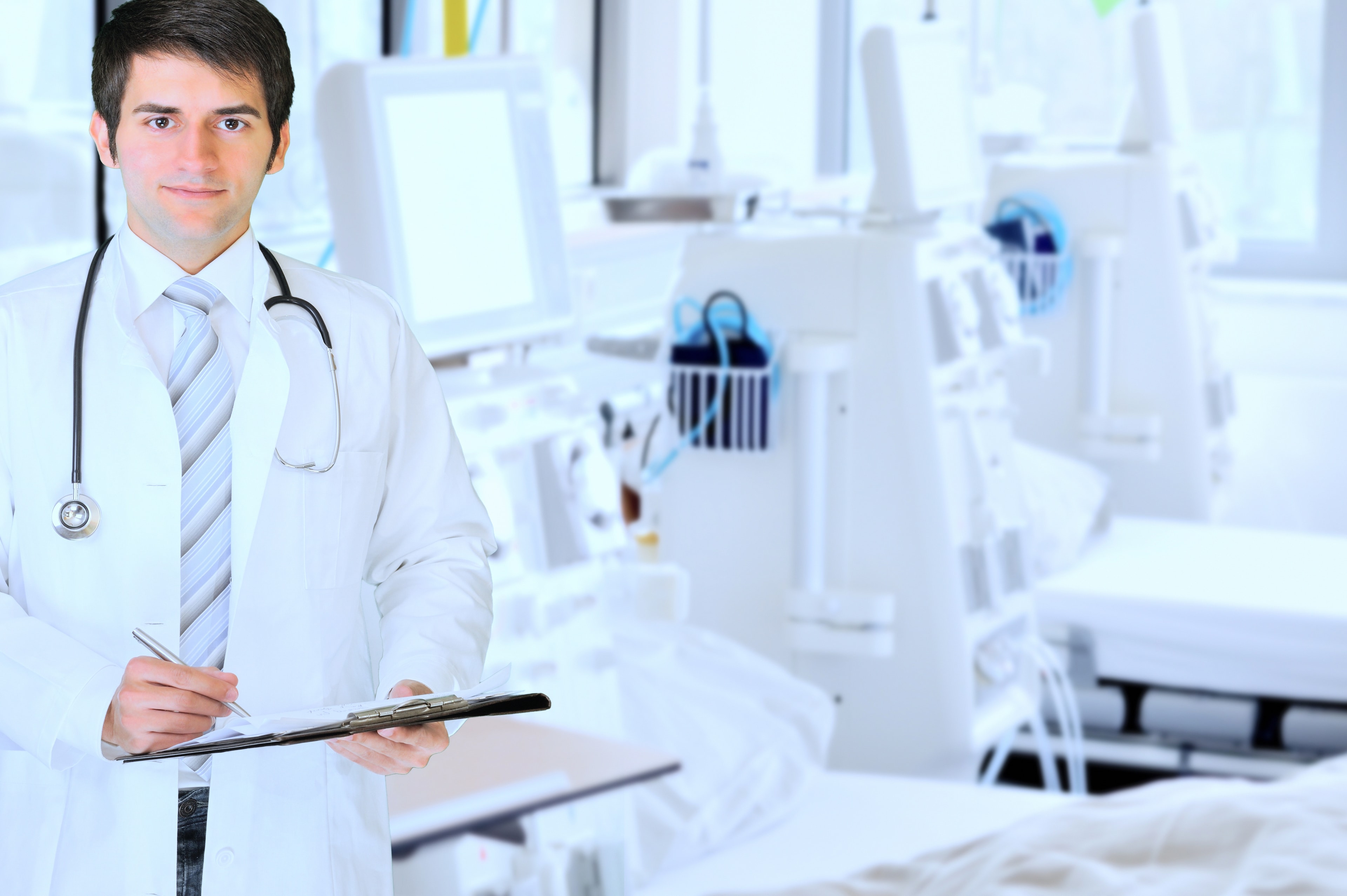 Cash Care Health physician reviewing patient chart in clinic